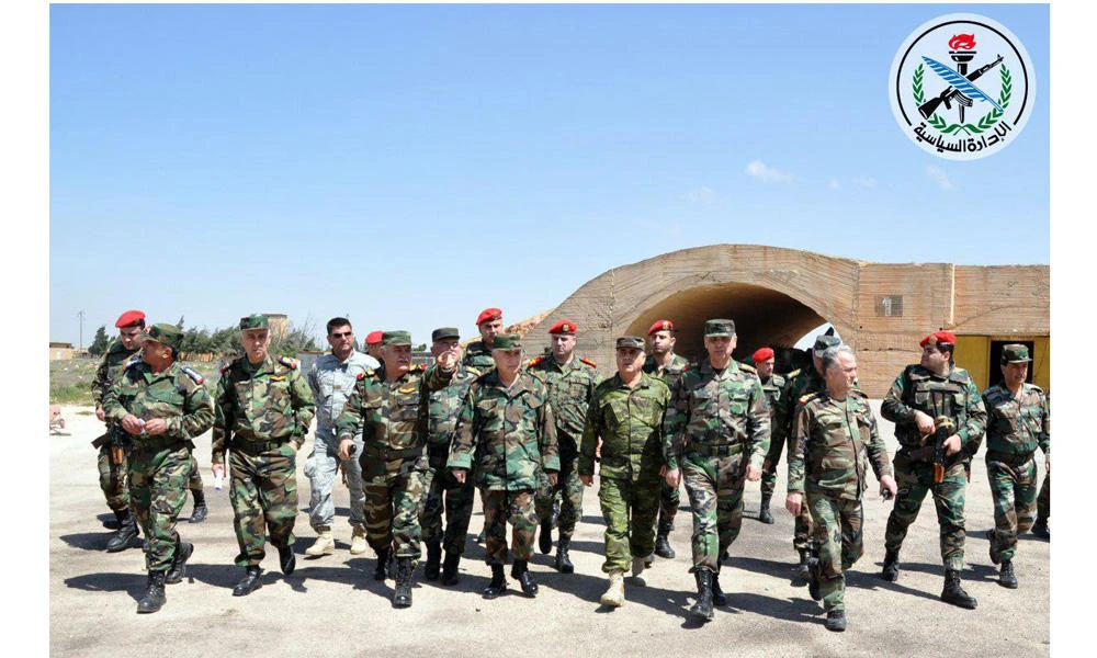 Syrian Armed Forces' chief of staff Ali Abdullah Ayyoub (C) is shown visiting Shayrat airfield in Homs, which was targeted by American missiles on April 7, 2017. (SANA handout via AFP)