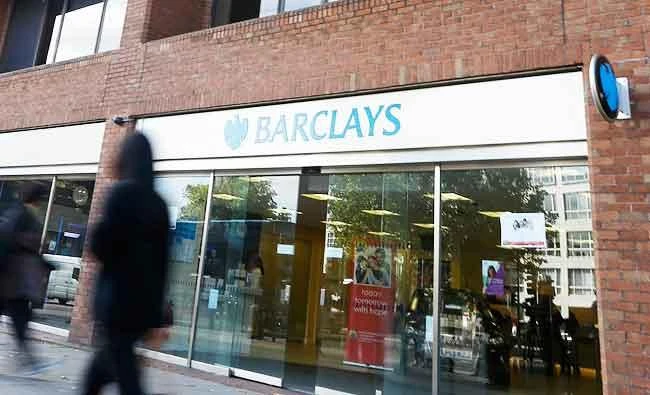 Pedestrians pass a branch of Barclays Bank in Swiss Cottage in London, in this Sept. 20, 2013 file photo. (AP)