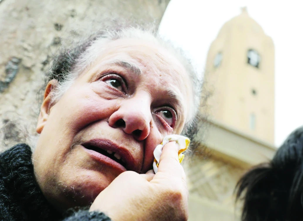 A relative of one of the victims reacts after a church explosion killed dozens in Tanta, Egypt, on Sunday. (Reuters)