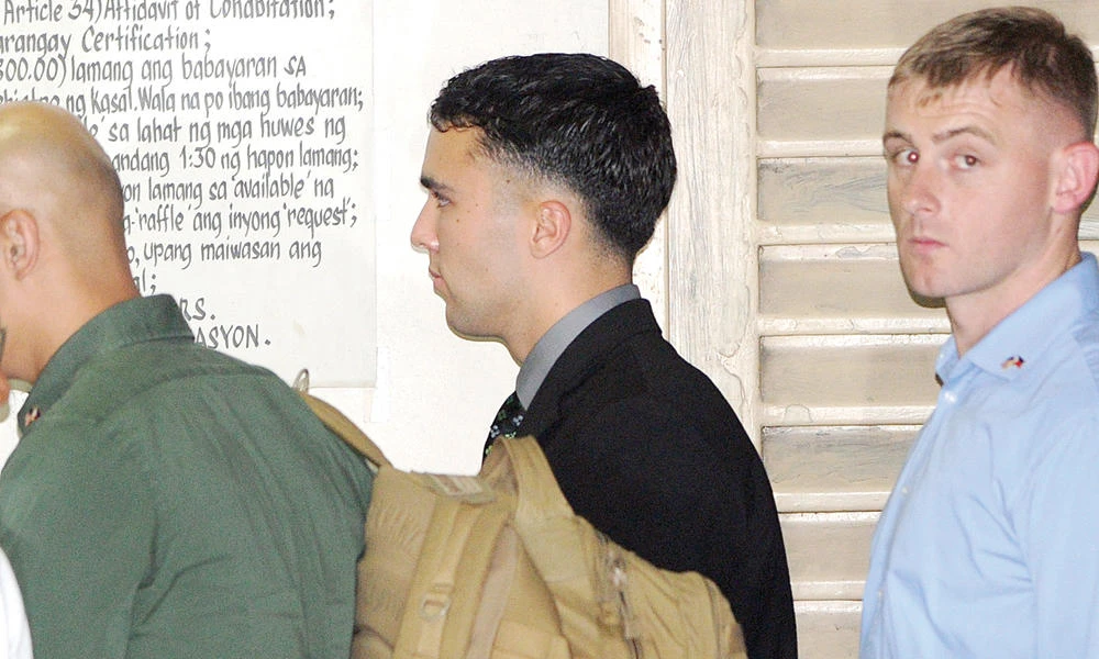 US Marine Private First Class Joseph Scott Pemberton (C) leaves a court building in the Philippine city of Olongapo, north of Manila, on March 23, 2015 after facing the first day of his trial for the murder of transgender Filipina Jennifer Laude. The Philippine Court of Appeals has upheld a guilty verdict on Perberton. (AFP file photo)