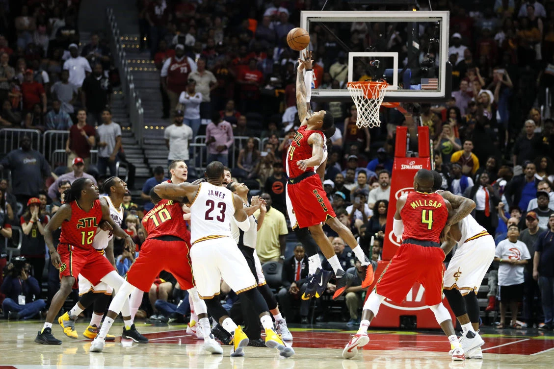 Atlanta Hawks forward Kent Bazemore (24) goes up for the jump ball in the final seconds of the second half of an NBA basketball game against the Cleveland Cavaliers on Sunday. (AP)