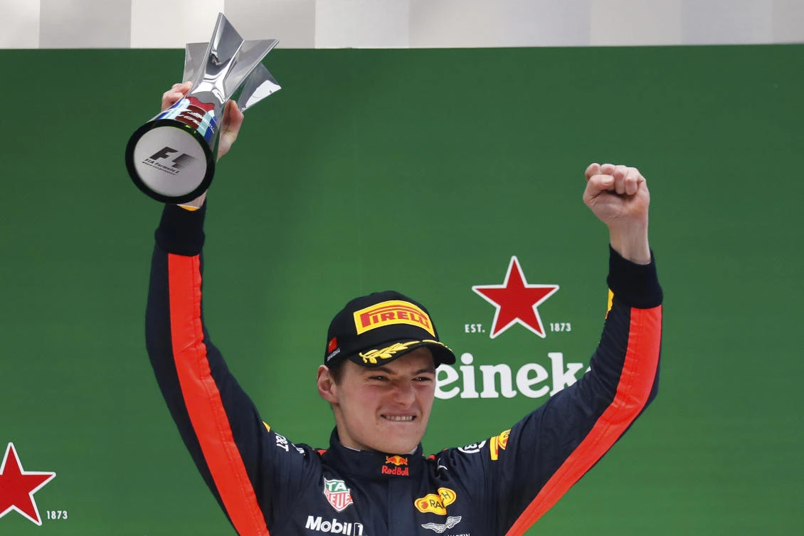 Red Bull driver Max Verstappen of the Netherlands celebrates on the podium after finishing third in the Chinese Formula One Grand Prix at the Shanghai International Circuit in Shanghai Sunday. (AP)