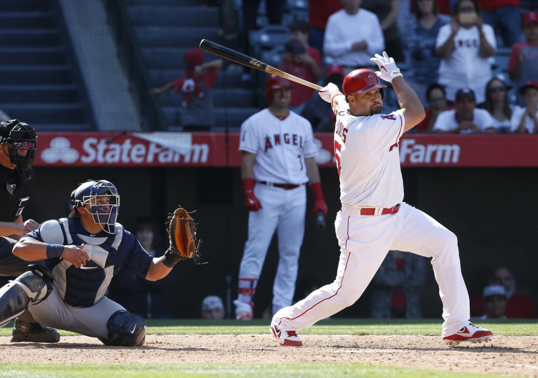 Los Angeles Angels designated hitter Albert Pujols hits a a two-run single in the ninth inning of a baseball game against the Seattle Mariner Sunday in Anaheim, Calif. the Angels won 10-9 (AP)
