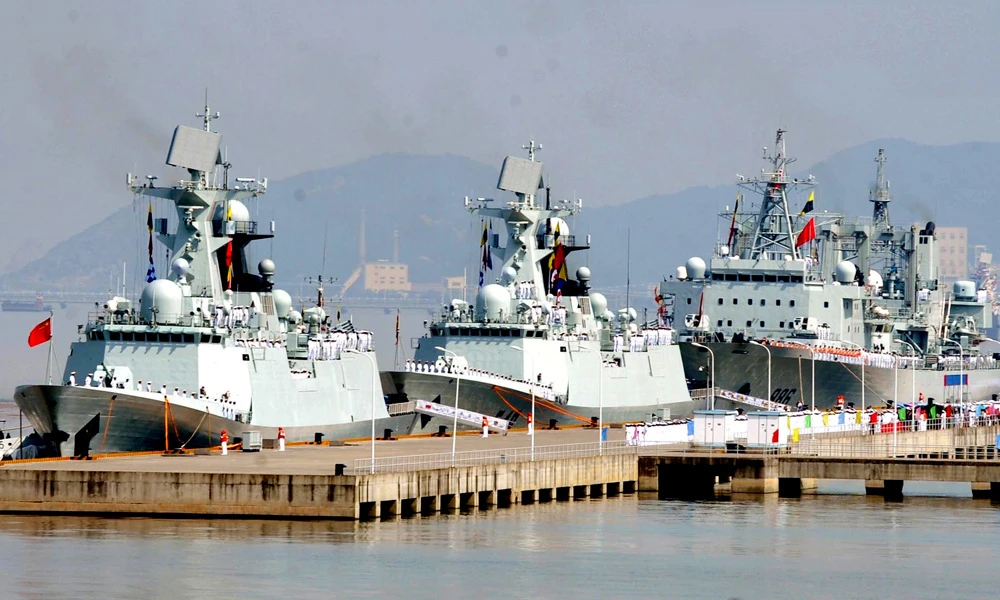 In this July 3, 2012 file photo released by China's Xinhua News Agency, the 12th Chinese naval flotilla, consisting of frigate "Yiyang", left, frigate "Changzhou" center, and comprehensive supply ship "Qiandaohu", prepare to set sail for the escort mission in the Gulf of Aden and Somali waters to protect commercial ships from pirate attacks at a port in Zhoushan, east China's Zhejiang Province. China's navy said Monday its forces rescued a freighter from attack by pirates in the Gulf of Aden over the weekend. (Hu Sheyou/Xinhua via AP)
