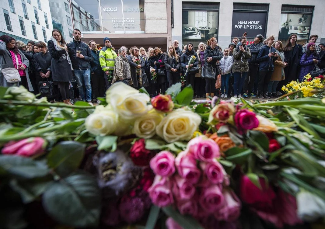 People observed a minute of silence to commemorate the victims of Friday's terror attack in Stockholm, Sweden. (AFP)