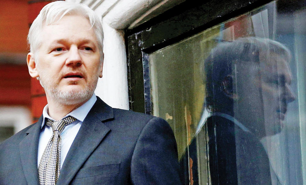 Julian Assange stands on the balcony of the Ecuadorian Embassy in London. (File photo: Reuters)