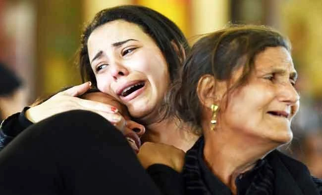 Women mourn for the victims of the blast at the Coptic Christian Saint Mark's church in Alexandria the previous day during a funeral procession at the Monastery of Marmina in the city of Borg El-Arab, east of Alexandria, on Monday. (AFP)