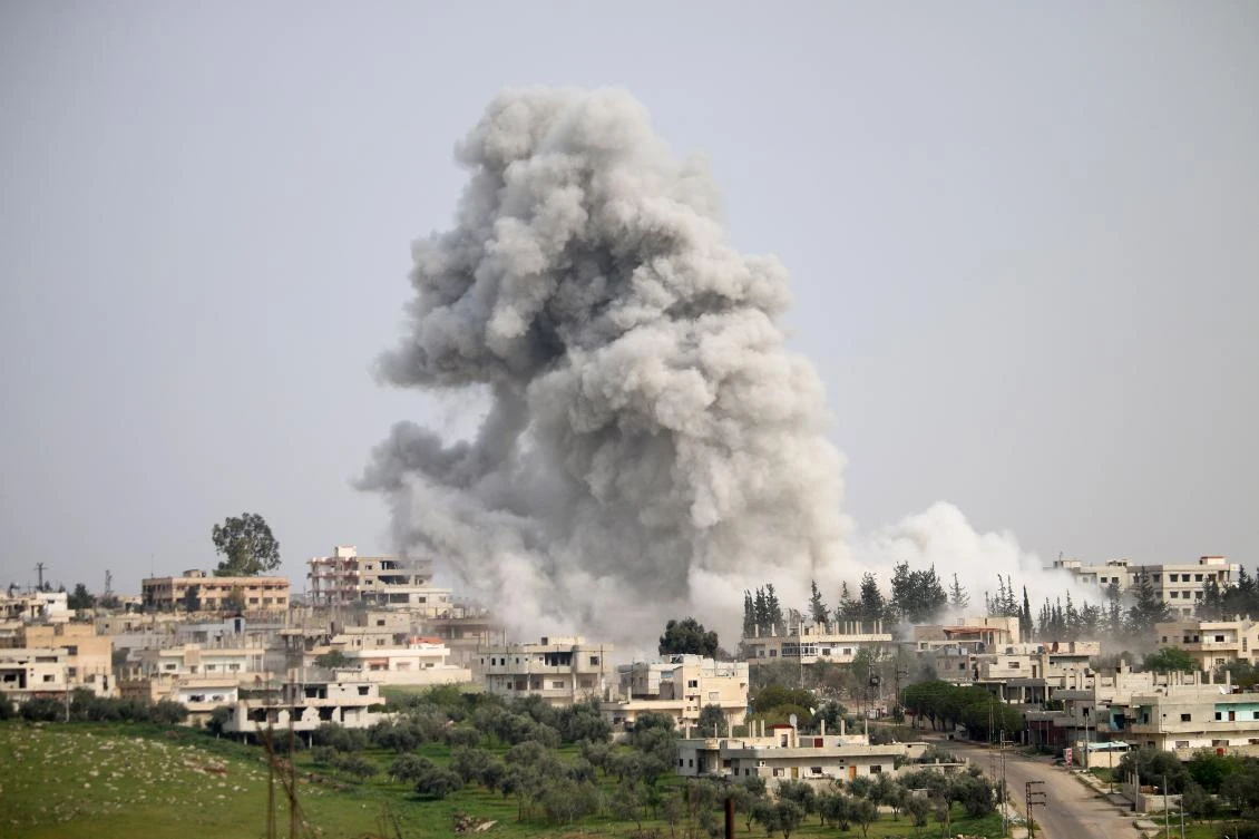Smoke billows following a reported airstrike on an opposition-held area in the southern Syrian city of Daraa, on Saturday. (AFP)