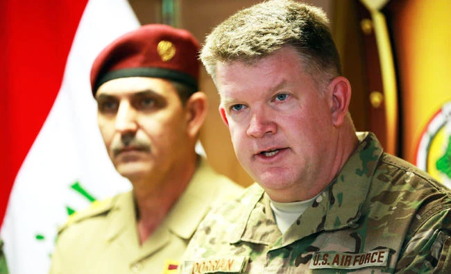 Col. John Dorrian, right, a U.S. spokesman for the coalition, speaks during a press conference with Brig. Gen. Yahya Rasool, an Iraqi military spokesman in Baghdad, Iraq, on Tuesday. (AP)