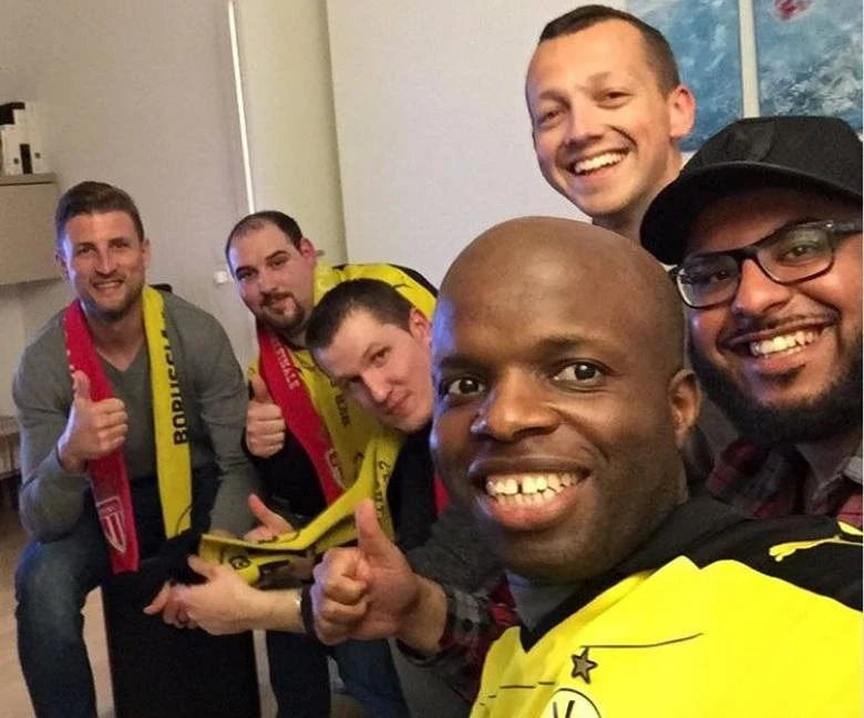 Photos started popping up on Twitter of fans wearing football shirts of the two opposing teams sitting together in living rooms across the city. (Photo courtesy: Twitter)