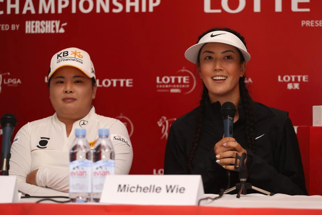 Michelle Wie speaks at a press conference ahead of the LPGA LOTTE Championship presented by Hershey at Ko Olina Golf Club on Tuesday in Kapolei, Hawaii. At left is Inbee Park of South Korea. (AFP)