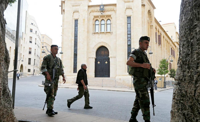 Lebanese army soldiers secure the area outside the parliament building in downtown Beirut, Lebanon. (Reuters)