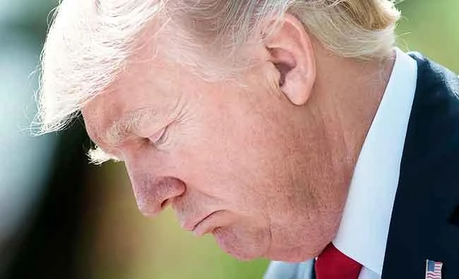 US President Donald Trump pauses while speaking during a press conference with Jordan's King Abdullah II in the Rose Garden of the White House, in this April 5, 2017 photo, in Washington, DC. (AFP)