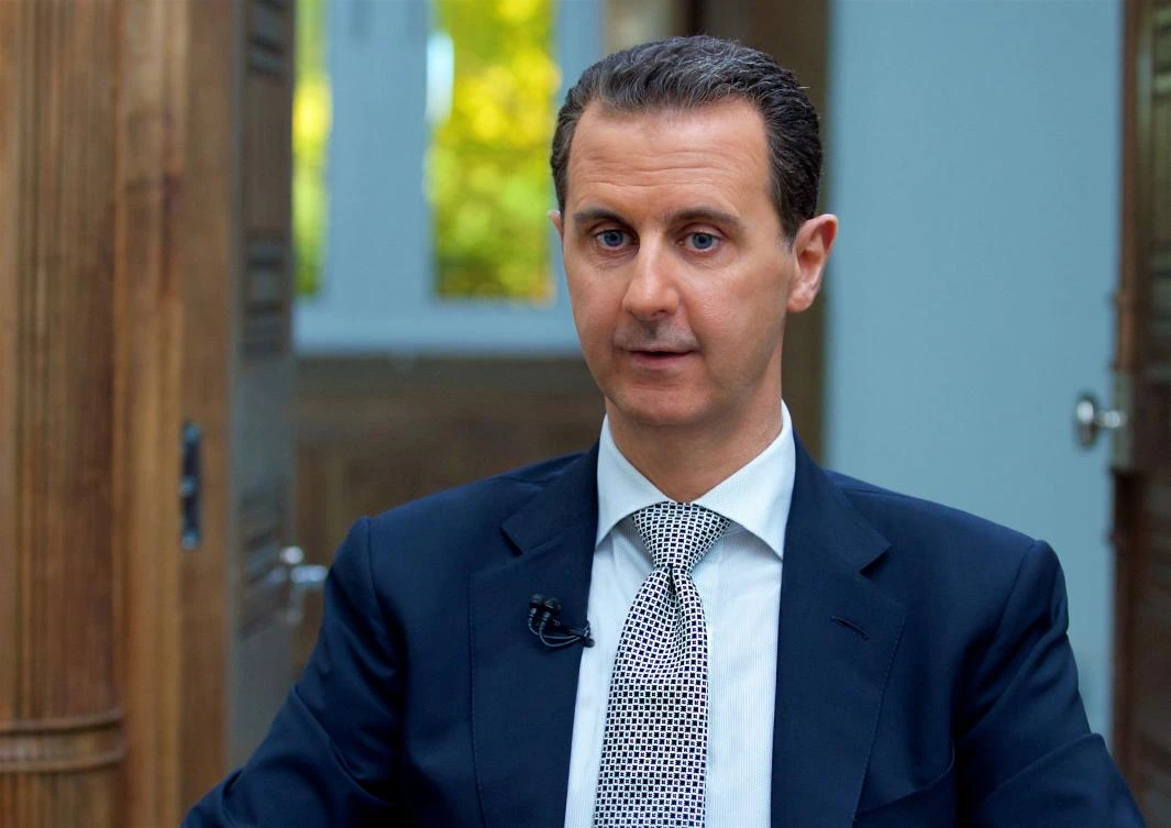 A handout picture released by the Syrian presidency's press office shows Syrian President Bashar al-Assad during an interview with AFP in the capital Damascus, on April 12, 2017. (AFP)