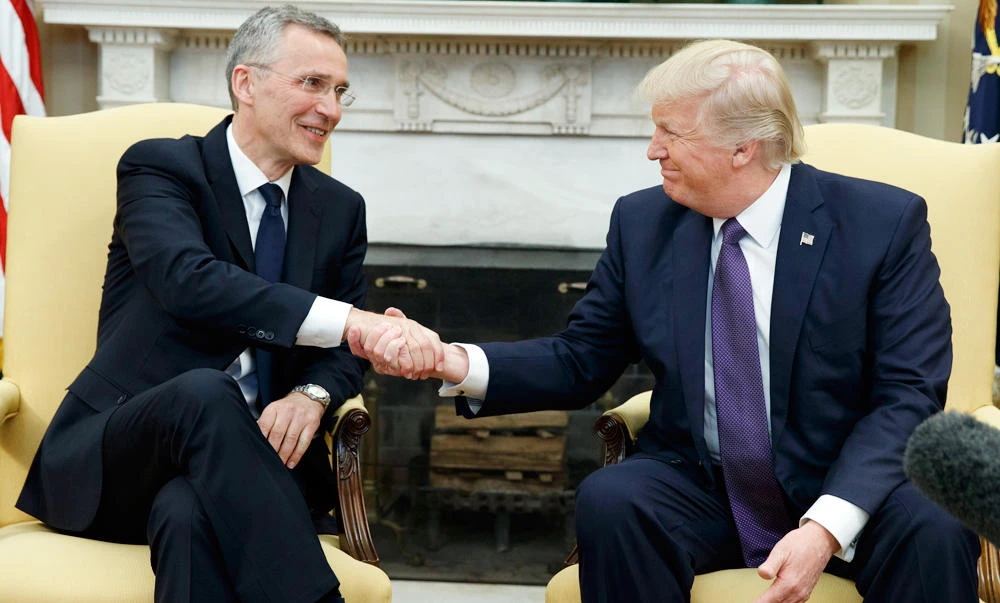 President Donald Trump shakes hands with NATO Secretary General Jens Stoltenberg in the Oval Office of the White House in Washington, on Wednesday. (AP)
