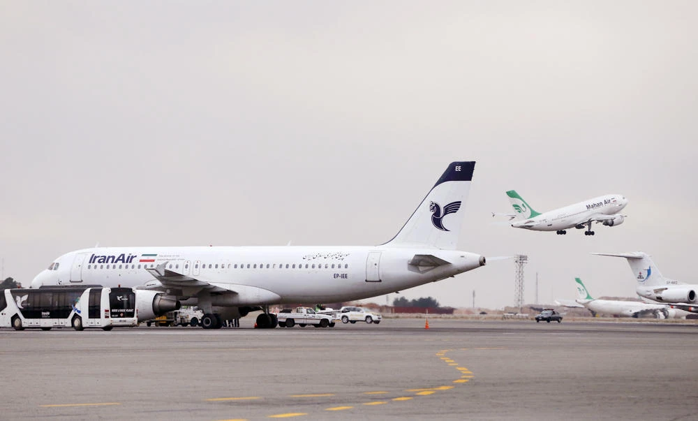 An Iranian Mahan Air passenger plane takes off at Mehrabad airport in Tehran on in this Feb. 7, 2016 file photo. European airplane manufacturer ATR said it signed a deal with Iran Air for 20 aircraft with option for 20 more on Thursday. (AP Photo/Vahid Salemi, File)