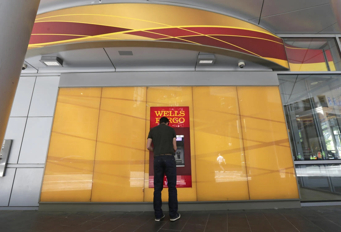 A man uses a Wells Fargo ATM. (AP)