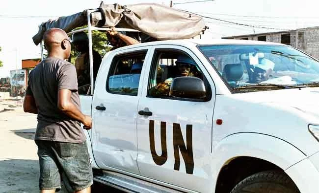 A civilian talks to peacekeepers serving in the United Nations Organization Stabilization Mission in the Democratic Republic of the Congo (MONUSCO) patrolling in the Limete Municipality of the Democratic Republic of Congo's capital Kinshasa, in this April 10, 2017 photo. (REUTERS)