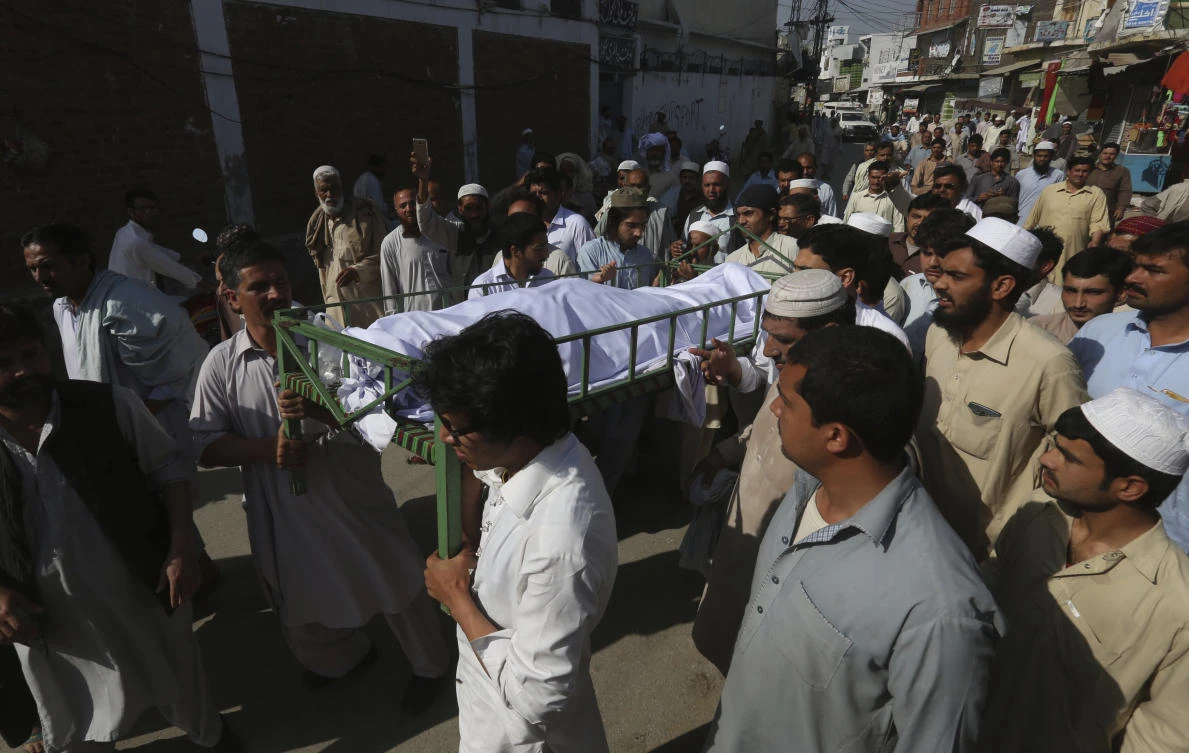 Villagers carry a body of a student Mohammad Mashal for burial in Swabi, Pakistan(AP Photo)