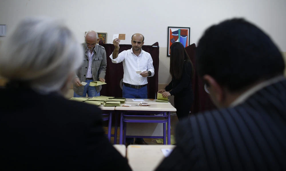 Election officials count votes at a polling station during a referendum in Izmir, Turkey, on Sunday. (REUTERS/Osman Orsal)