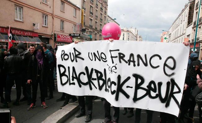 People take part in a anti-facist demonstration on Sunday at the 4 Chemins crossroads in Aubervilliers, outside Paris, on the eve of a campaign meeting of French presidential election candidate for the far-right Front National (FN) party that is to take place at the nearby Zenith venue in Paris. (AFP / GEOFFROY VAN DER HASSELT)