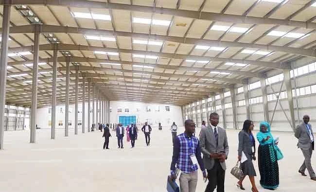 Visitors and business people tour a factory building on a U.N. organised trip to Senegal's new Diamniadio industrial park in Senegal, in this November 15, 2016 file photo. (REUTERS)