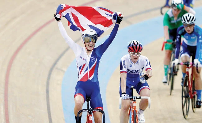 Elinor Barker of Britain celebrates after winning a gold medal in the UCI Track World Championships Women's Points Race final in Hong Kong Sunday. (Reuters)