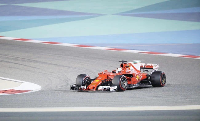 Ferrari's German driver Sebastian Vettel steers his car during the Bahrain Formula One Grand Prix at the Sakhir circuit in Manama on Sunday. (AFP)