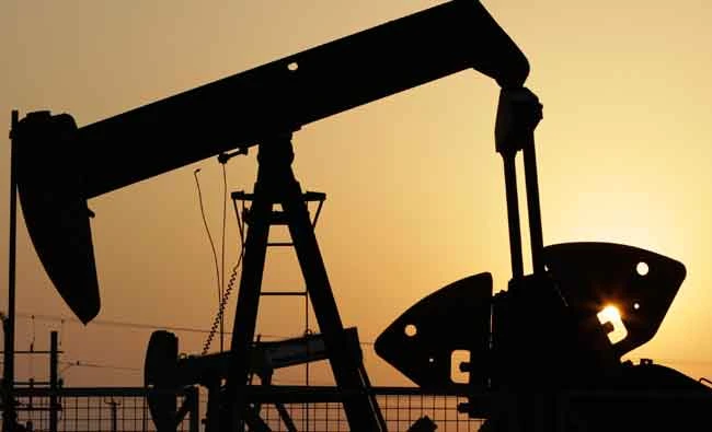 In this Sept. 30, 2015 file photo, oil pumps work in the desert oil fields of Sakhir, Bahrain. (AP)