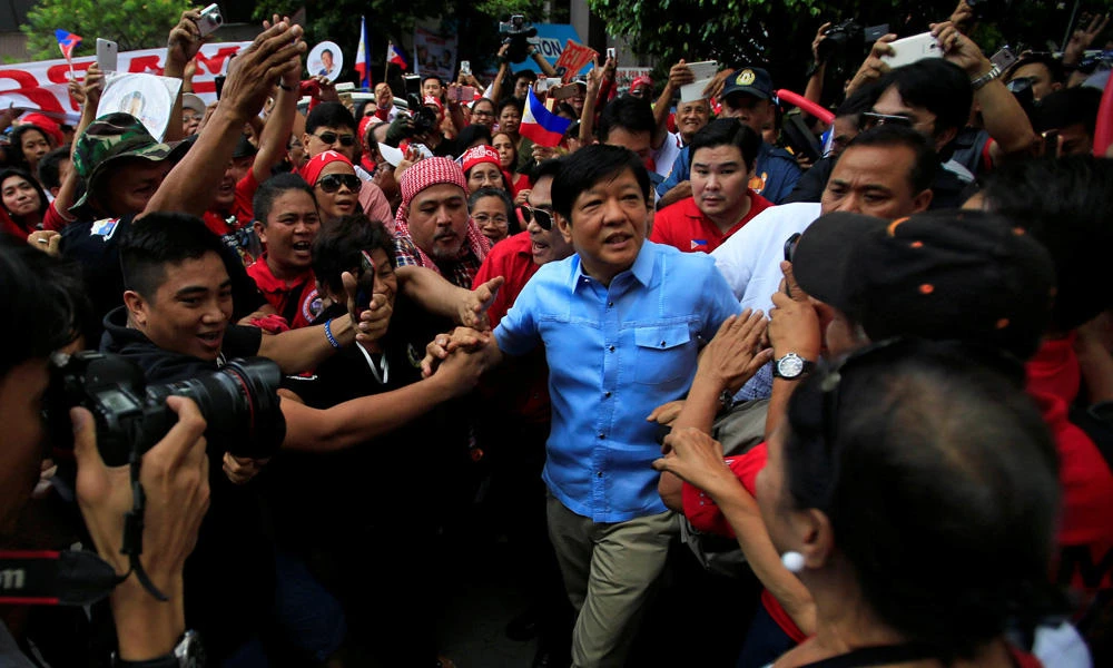 Former senator Ferdinand "Bongbong" Marcos Jr. and son of late former dictator Ferdinand Marcos is greeted by his supporters upon his arrival at the Supreme Court in metro Manila, Philippines, on Monday. (REUTERS/Romeo Ranoco)
