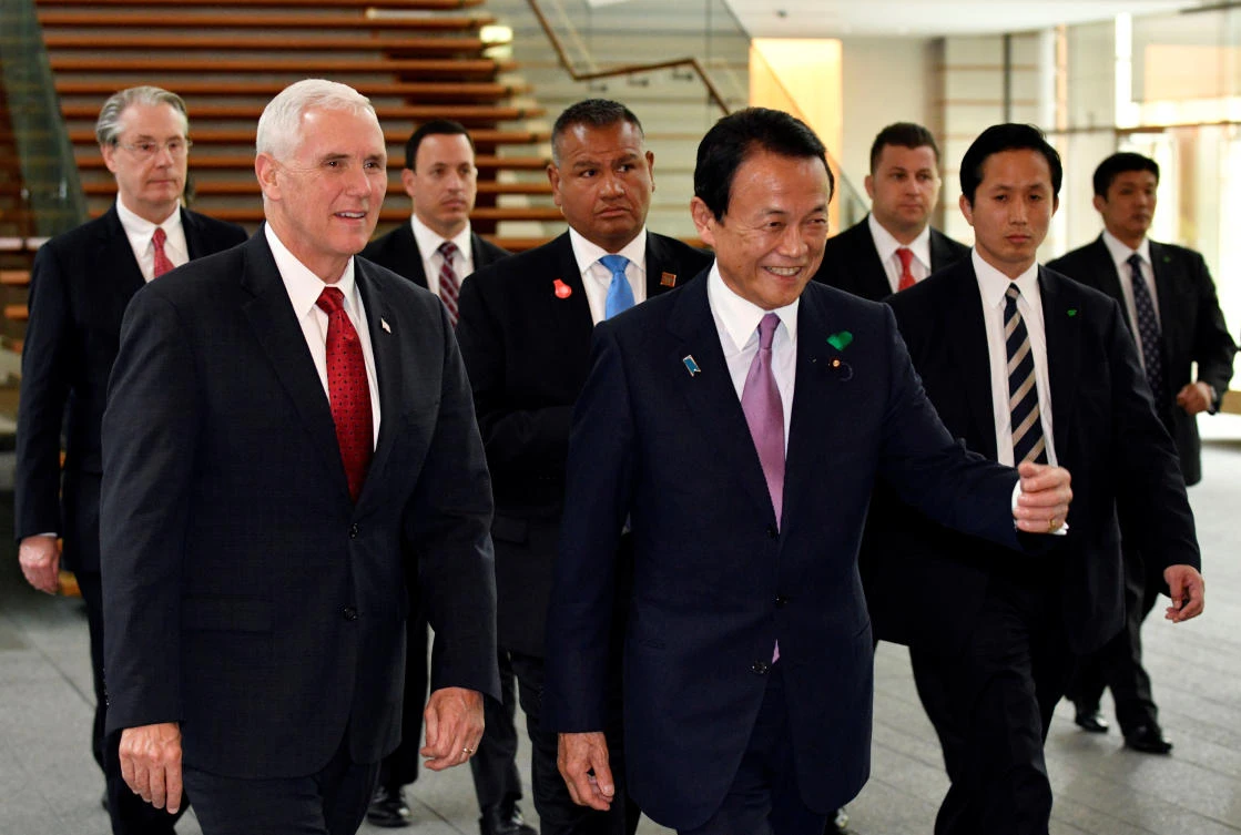 US Vice President Mike Pence (L) is escorted by Japan’s Deputy Prime Minister Taro Aso. (Reuters)