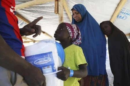 A girl fleeing violence in Nigeria receives non-food supplies after crossing the border in Ngouboua, January 19, 2015. (REUTERS)