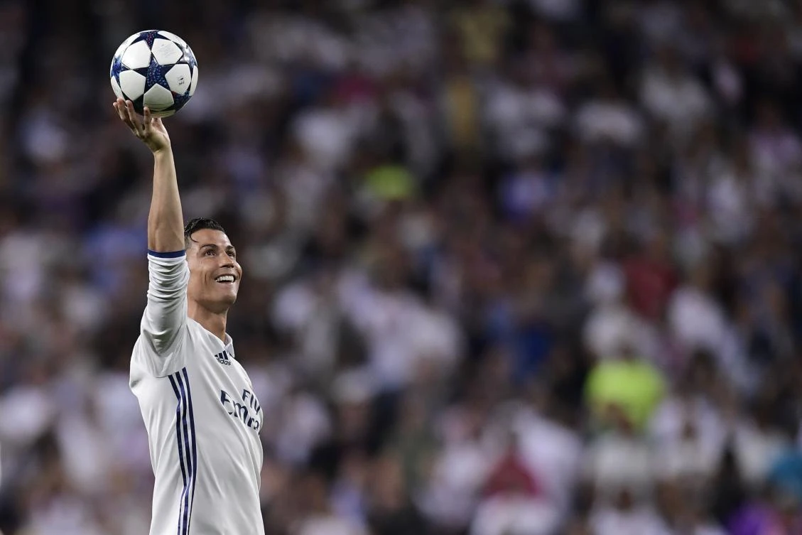 Real Madrid's Portuguese forward Cristiano Ronaldo celebrates during the UEFA Champions League quarter-final second leg football match Real Madrid vs FC Bayern Munich at the Santiago Bernabeu stadium in Madrid in Madrid on April 18, 2017. (AFP)