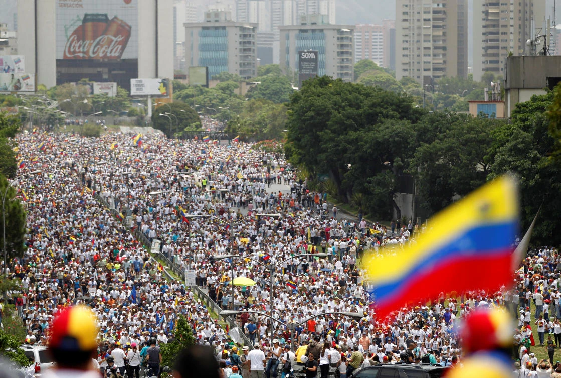 Demonstrators clash with riot police during the so-called "mother of all marches" against Venezuela's President Nicolas Maduro in Caracas, Venezuela on Wednesday. (REUTERS/Christian Veron)
