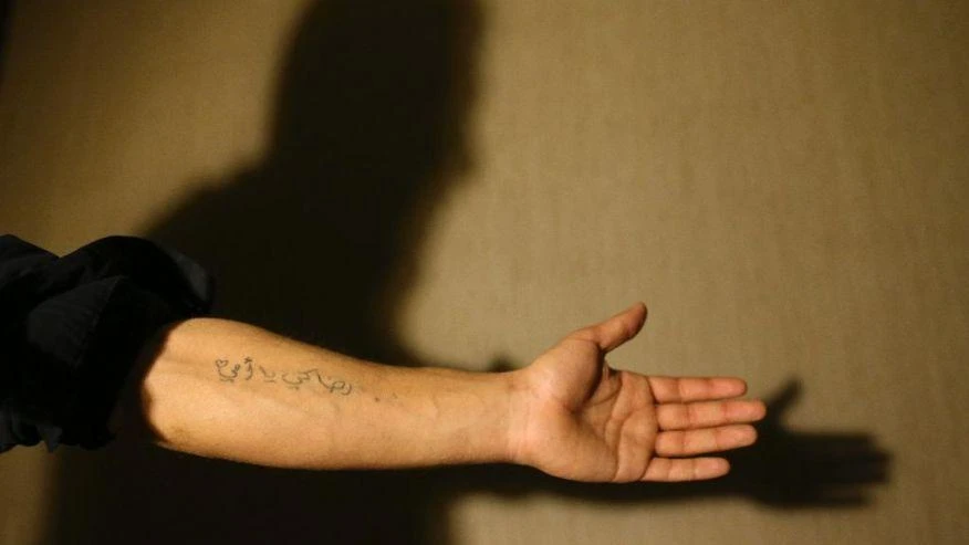 In this March 21, 2017 photograph, Mohammmed, last name not given, shows a tattoo on his forearm that reads in Arabic: "All for you, mother", during an interview with The Associated Press, in Gaziantep, southeastern Turkey. (AP)