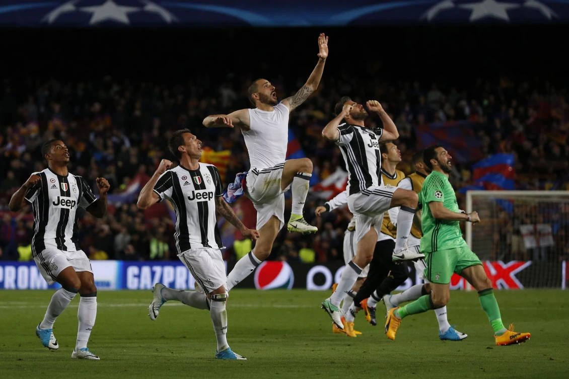 Juventus players celebrate after winning the UEFA Champions League quarterfinal second leg football match FC Barcelona vs. Juventus at the Camp Nou stadium in Barcelona on Wednesday. (AFP)