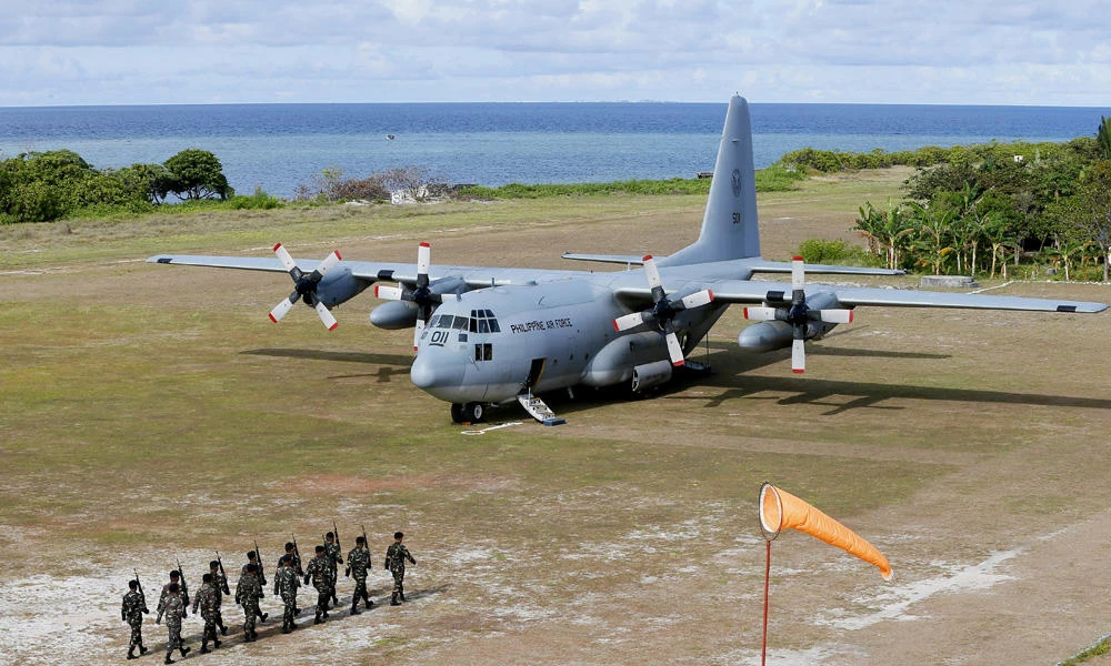 China, Philippines argue over defense chief’s island visit