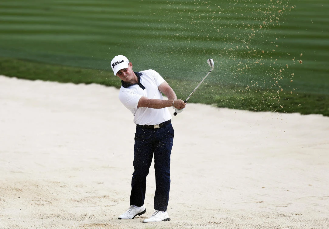 Bud Cauley hits out of a fairway bunker on the 17th hole during the second round of the Texas Open golf tournament Friday in San Antonio, Texas. (The San Antonio Express-News via AP)