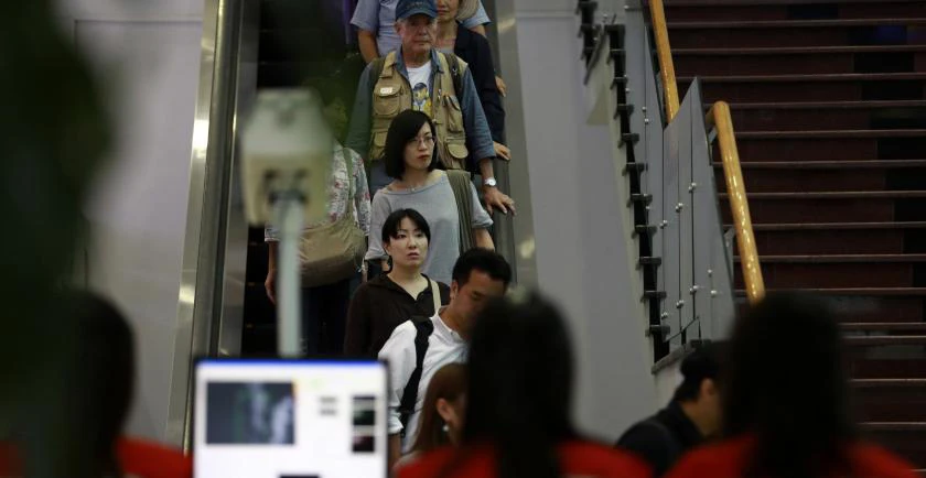 Travelers arrive at the Yangon International Airport. (Reuters)