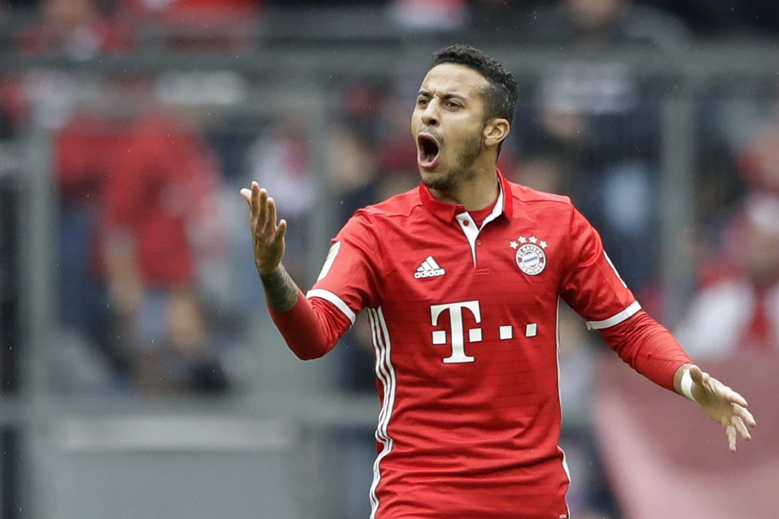 Bayern's Thiago Alcantara celebrates after scoring his side's second goal during the German Bundesliga soccer match between FC Bayern Munich and FSV Mainz 05 at the Allianz Arena stadium in Munich on Saturday. (AP)