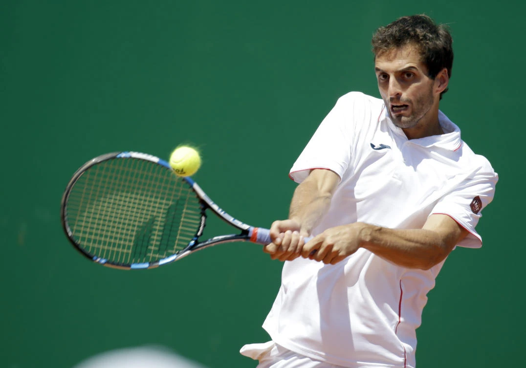Spain's Albert Ramos-Vinolas returns the ball to France's Lucas Pouille during their semifinal match of the Monte Carlo Tennis Masters tournament in Monaco Saturday. (AP)