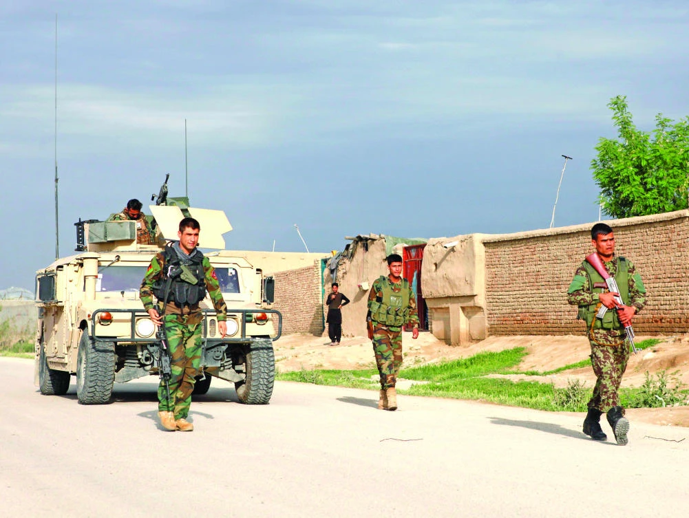 Afghan National Army (ANA) troops arrive near the site of an ongoing attack on an army headquarters in Mazar-i-Sharif on Friday. (Reuters)