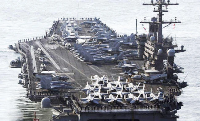 In this March 15, 2017, file photo, U.S. Navy aircraft carrier, the USS Carl Vinson, approaches Busan port in Busan, South Korea, to participate in an annual joint military exercise called Foal Eagle between South Korea and the United States. (AP)