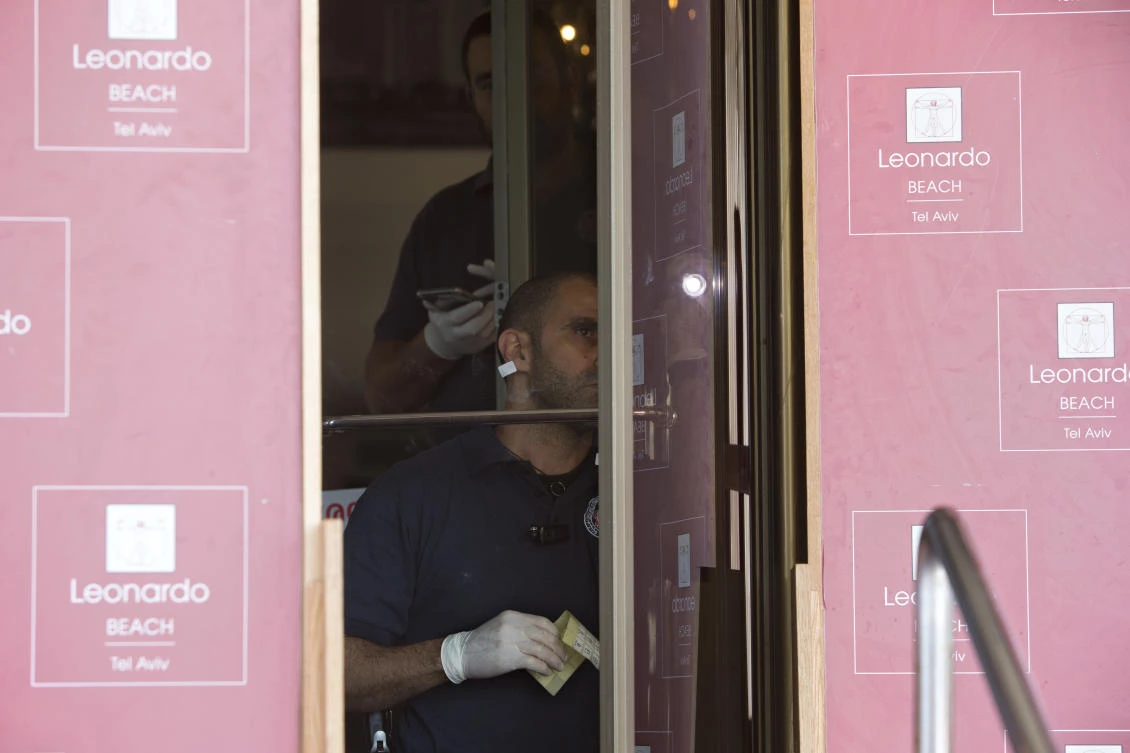 Israeli police officers inspect the scene of a stabbing attack in Tel Aviv, Israel. Israeli police say an 18-year-old Palestinian stabbed and lightly wounded four people in Tel Aviv before being arrested. (AP)