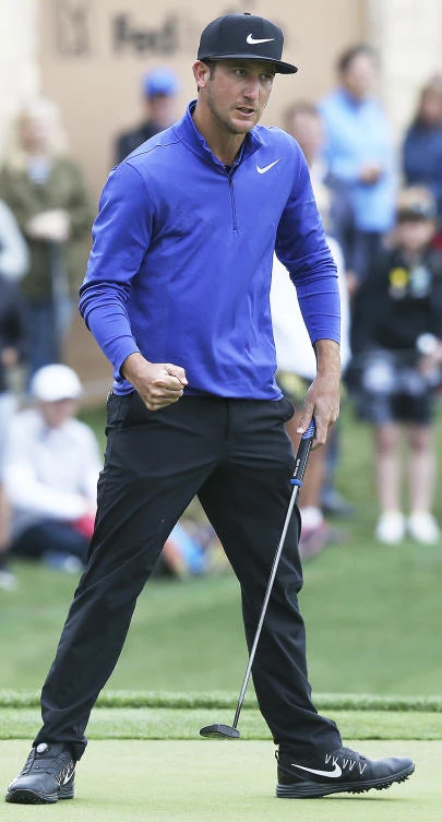 Kevin Chappell pumps his fist after sinking a par-saving putt on 18 to retain the lead during the third round of the Valero Texas Open golf tournament at TPC San Antonio Oaks Course on Saturday in San Antonio. (The San Antonio Express-News via AP)