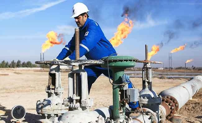 In this Jan. 12, 2017 photo, an Iraqi worker operates valves in Nihran Bin Omar field north of Basra, 340 miles southeast of Baghdad, Iraq. (AP)