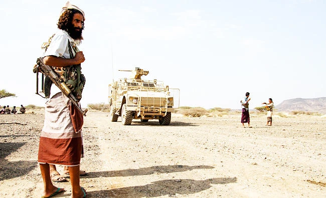 A Yemeni fighter loyal to the Saudi-backed Yemeni president stands at a position which was taken from Shiite-Houthi rebels in a mountainous region northwest of the central city of Taiz, in this Aril 20, 2017 photo. (AFP)