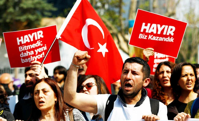 Anti-government demonstrators shout slogans during a protest in Kadikoy district of Istanbul, Turkey, on Sunday. (Reuters)