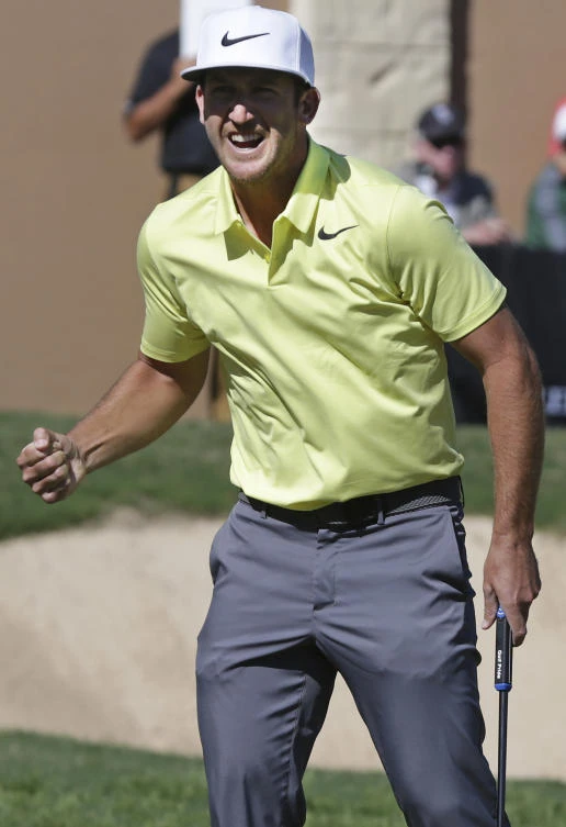 Kevin Chappell clinches his fist after sinking the winning birdie putt on the 18th green during the final round of the Valero Texas Open golf tournament Sunday in San Antonio. (The San Antonio Express-News via AP)
