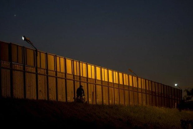 A border patrol agent drives along the US- Mexico border crossing on January 26, 2017, in San Ysidro, California.
(AFP)